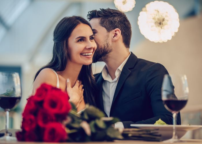 Happy Couple At Dinner Party