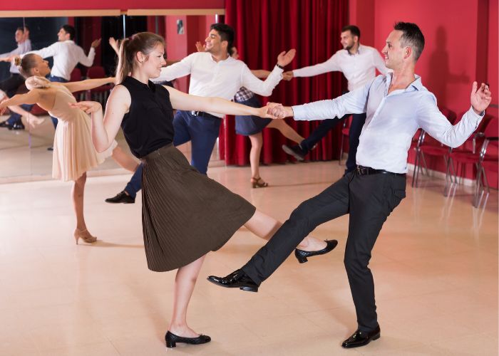 Happy Couple Enjoying A Playful Swing Dance
