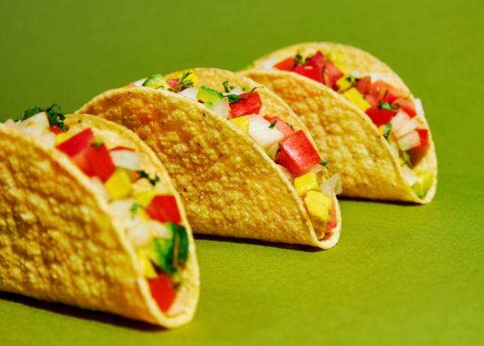 Four Crispy Tacos Filled With Fresh Vegetables