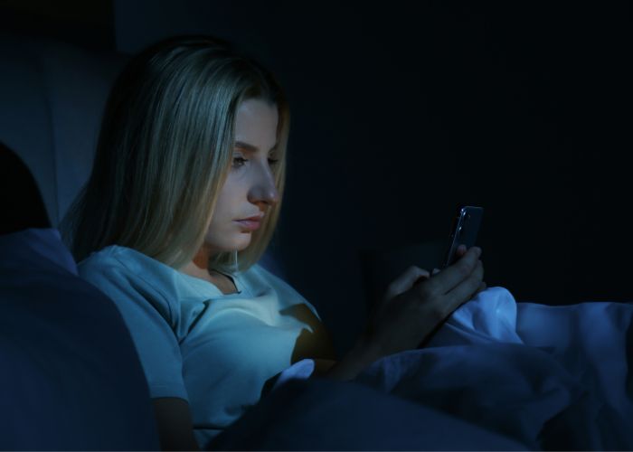 Woman Using Phone At Night