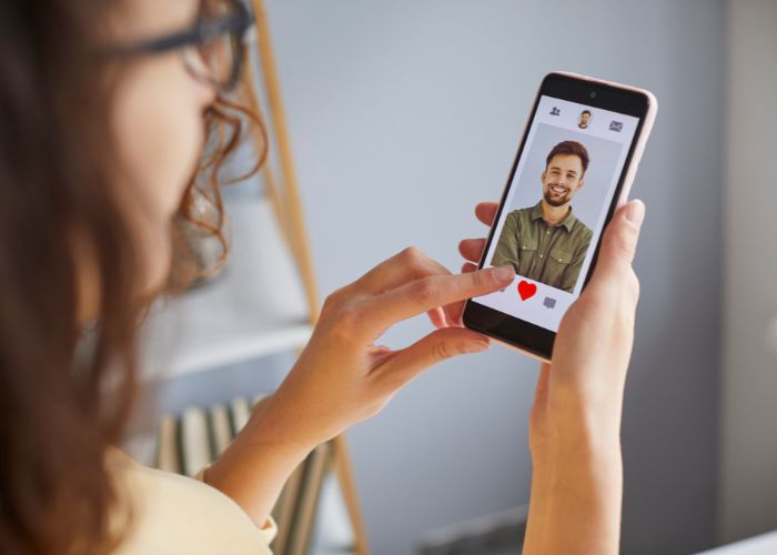 Woman Viewing A Man's Dating Profile