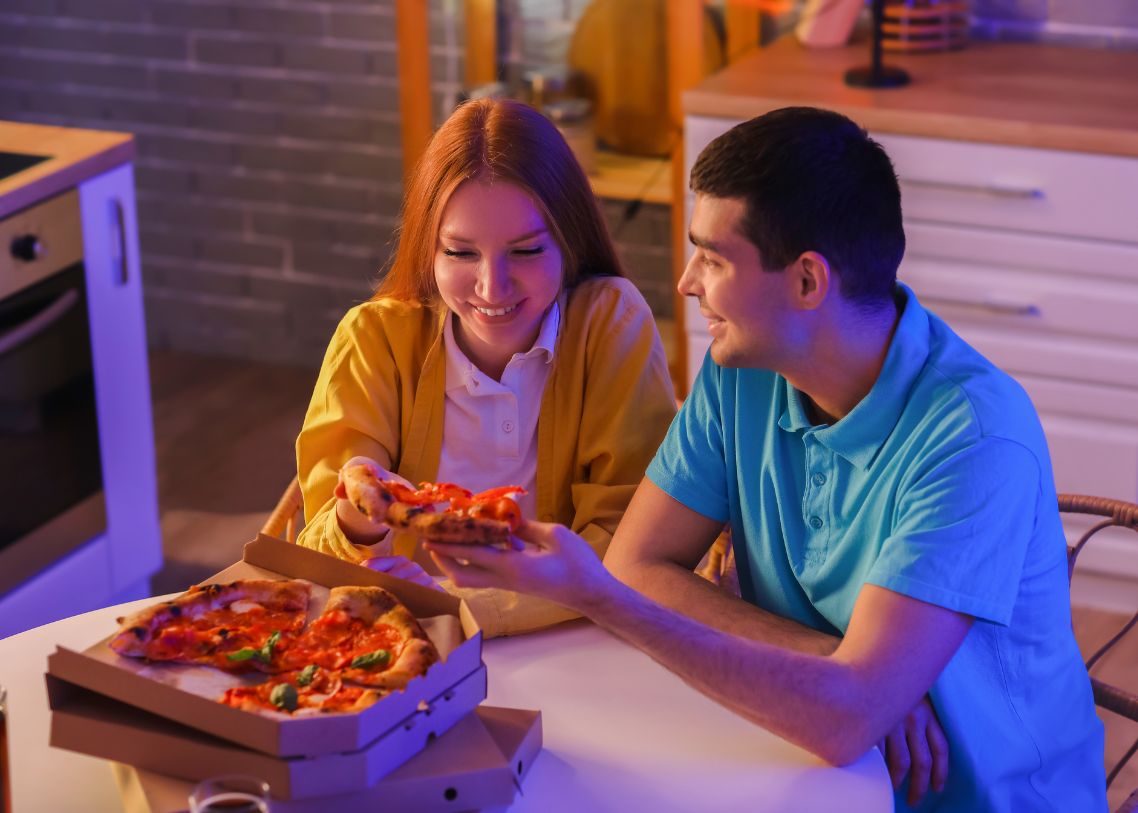 Couple Eating Pizza