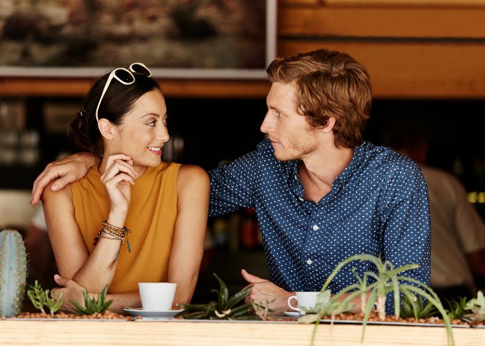 Couple At Cafe Looking Each Other