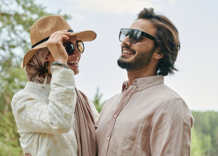 Couple Wearing Sunglasses Laughing