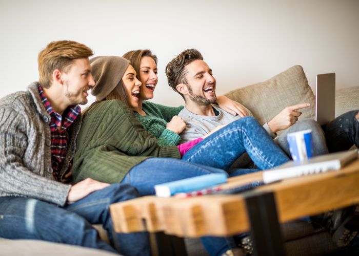 Couples Enjoying Movie At Home