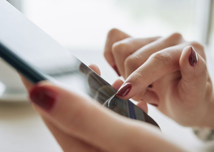 Close Up Of A Woman Using A Smartphone