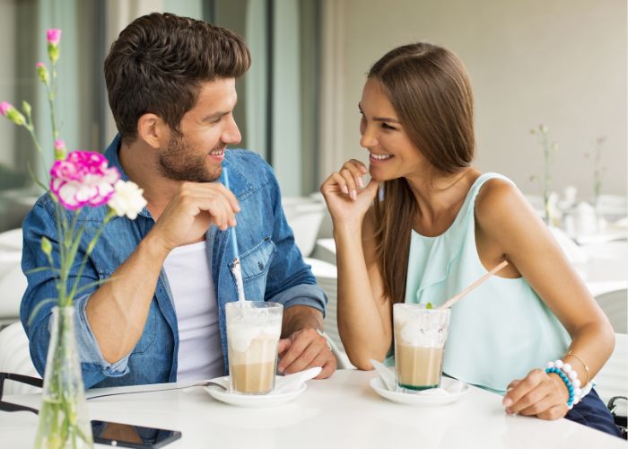 Talking Couple At Outdoor Cafe
