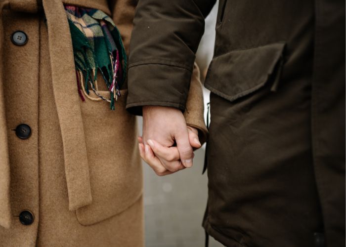 Close Up Of A Couple Holding Hands