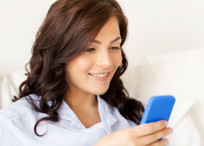 Happy Woman With Smartphone