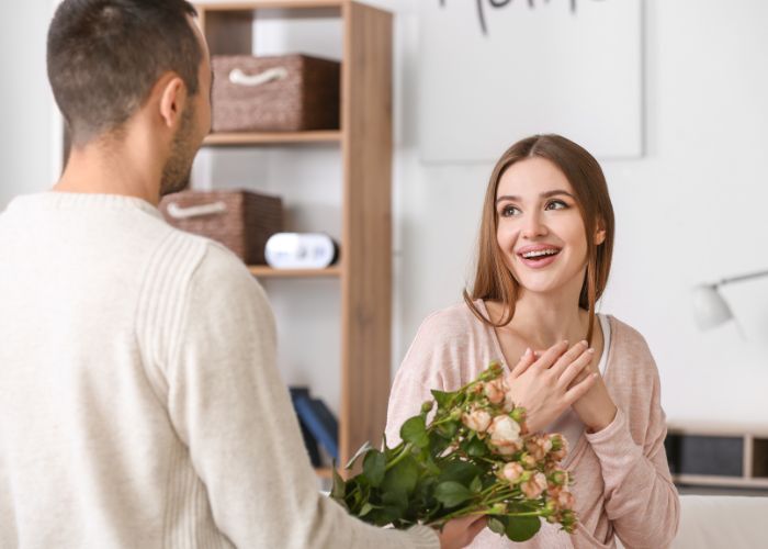 Beautiful Young Woman Receiving Flowers