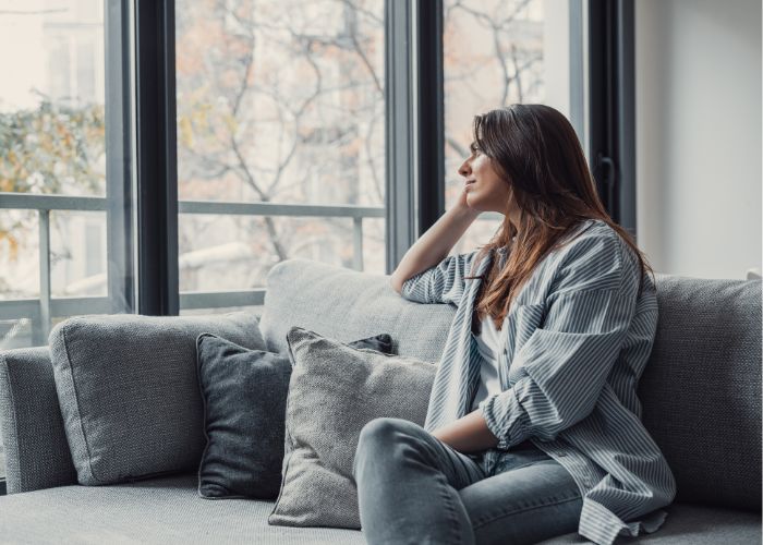 Alone Woman Sit On Couch