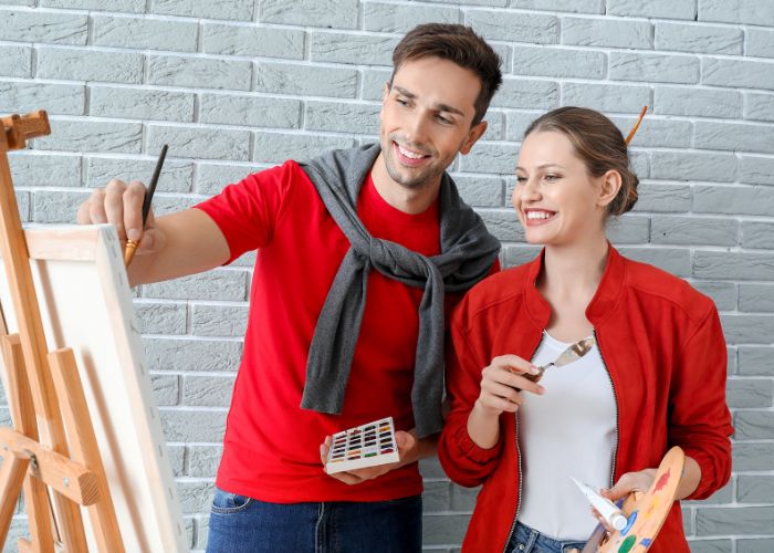 Couple Painting On A Canvas