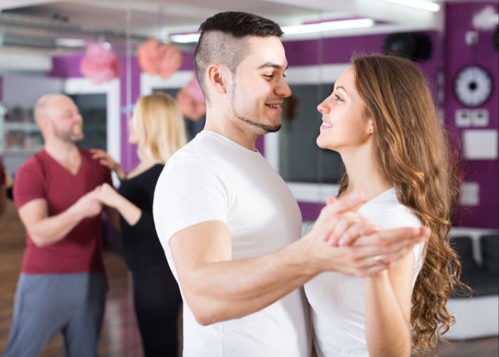 Couple Smiling While Taking A Dance Class Together