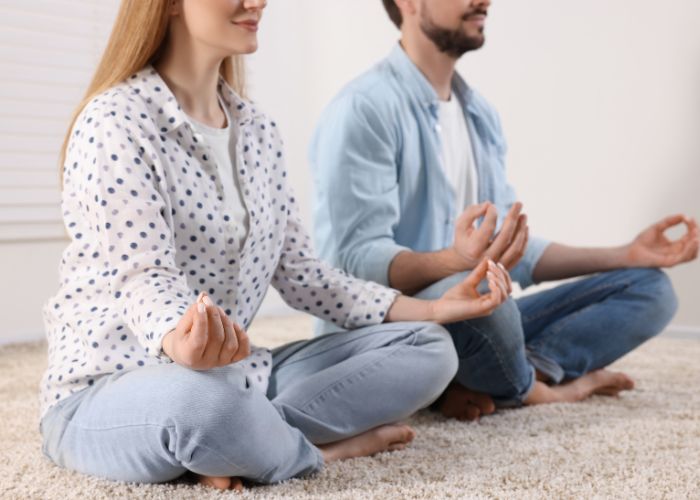 Couple Meditating Together Indoors