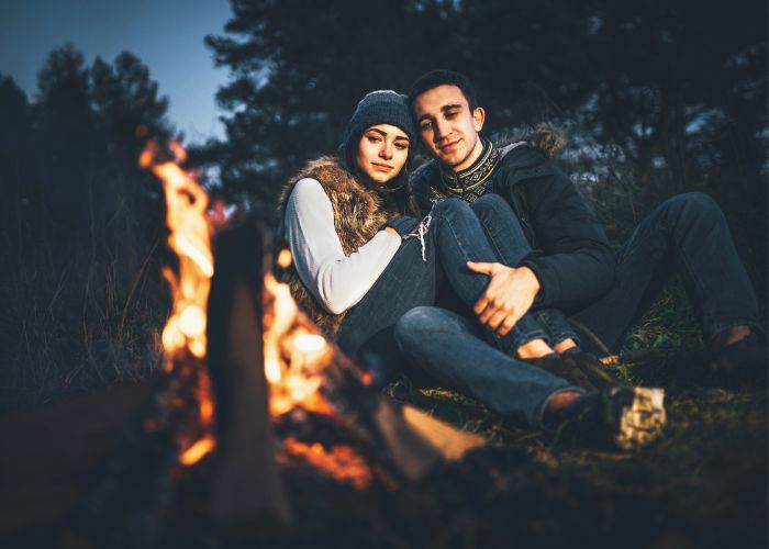 Pretty Couple Relaxing Near Bonfire
