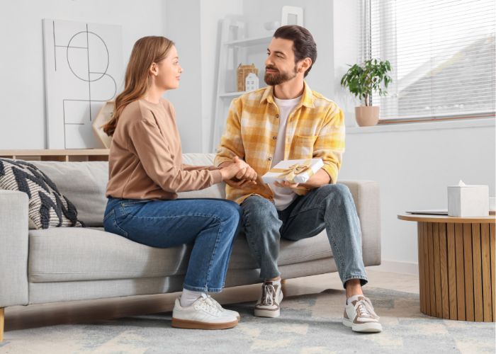 Man Giving Gift To Woman