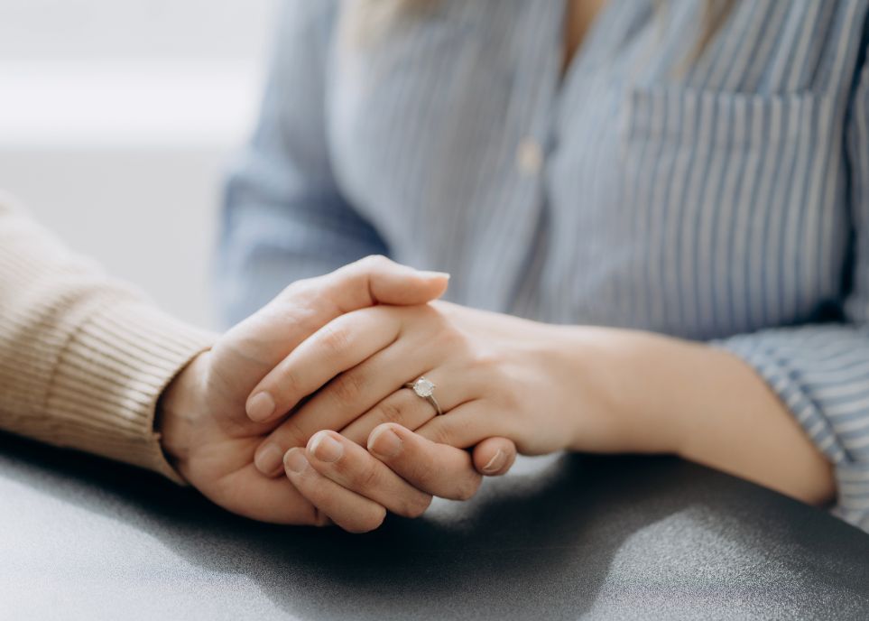 A Couple Holding Hands And Trusting Each Other Again