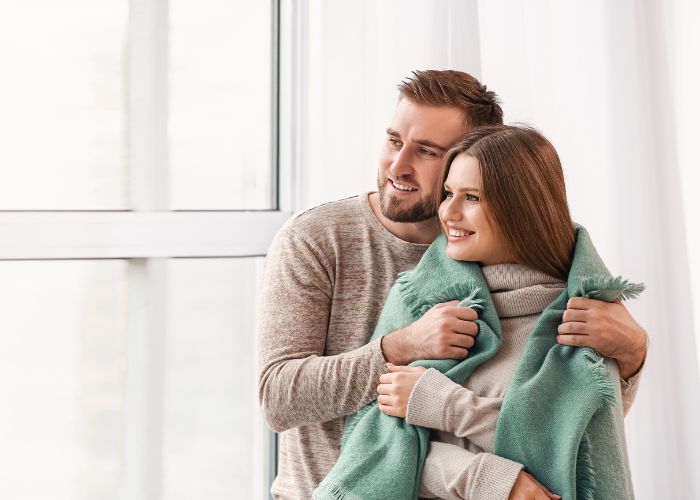 Happy Couple Near Window At Home