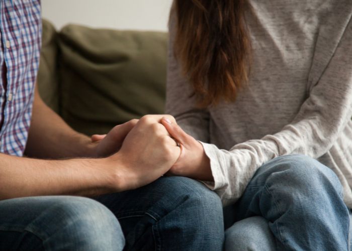 Close Up Of Couple Holding Hands